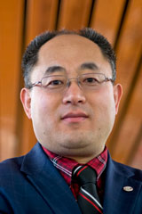 Huang Selected as Fellow