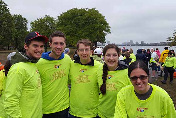 students in matching team yellow shirts at event