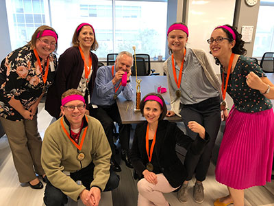 group of people in headbands and medals around their neck