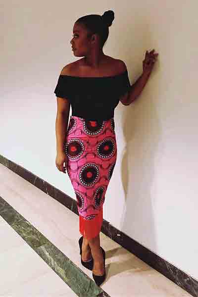 During African Night, a prominent fashion show event at Northeastern showcasing African fashion, Rachely Sanchez Murray poses for a photo in Ell Hall. As part of the event, members of the community are encouraged to wear their best African fashion option.