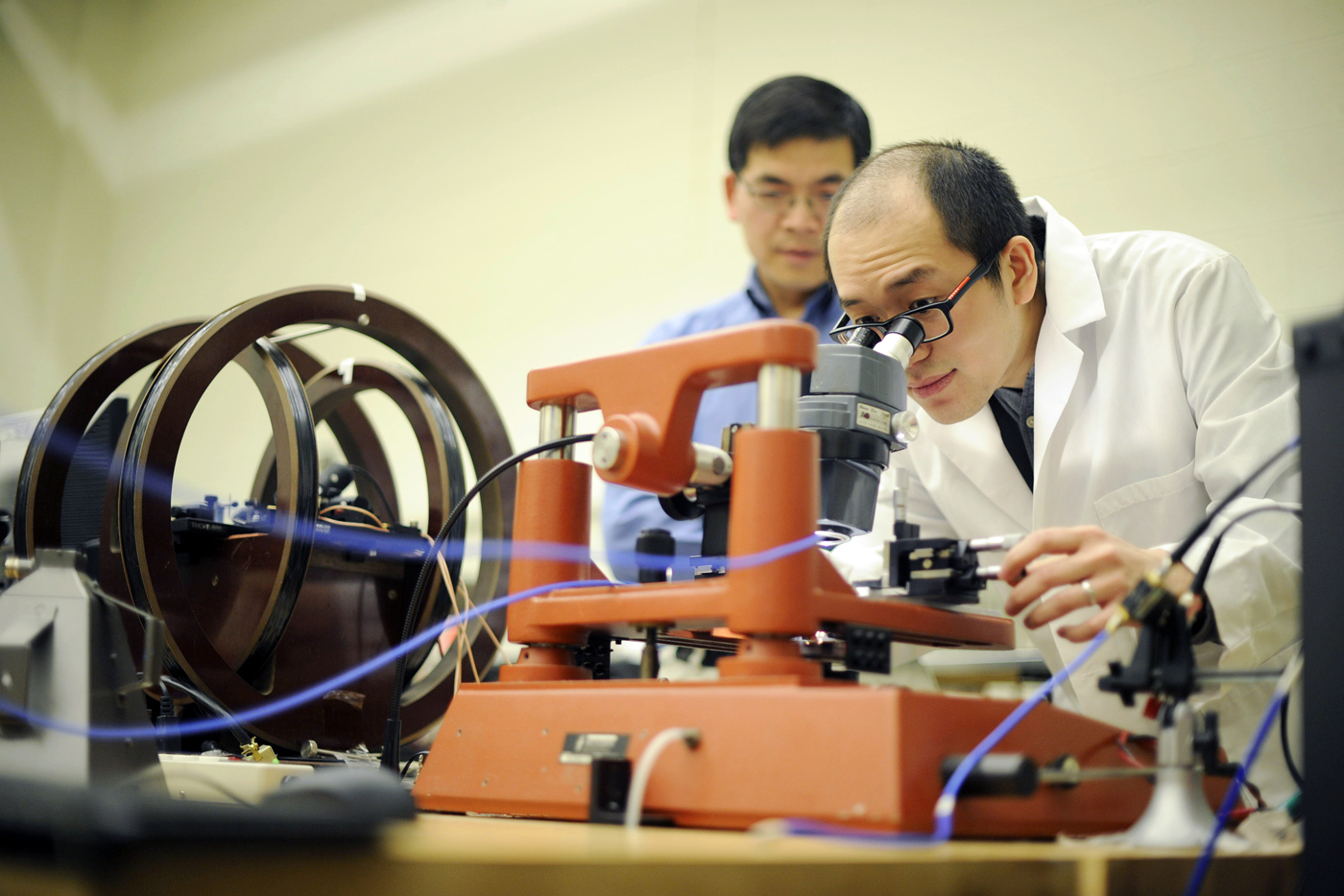 Nan works at the probe station for device testing in the Advanced Materials and Microsystems Lab.