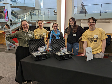  Molly Johnson, E’25, bioengineering and biochemistry, standing with OGL and MSC coworkers at the 2023 High School Marine Science Symposium.