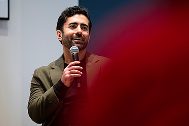 Hamed Tabkhi, PhD 2014 computer engineering, speaking on stage at the Young Alumni Impact Award Ceremony. 