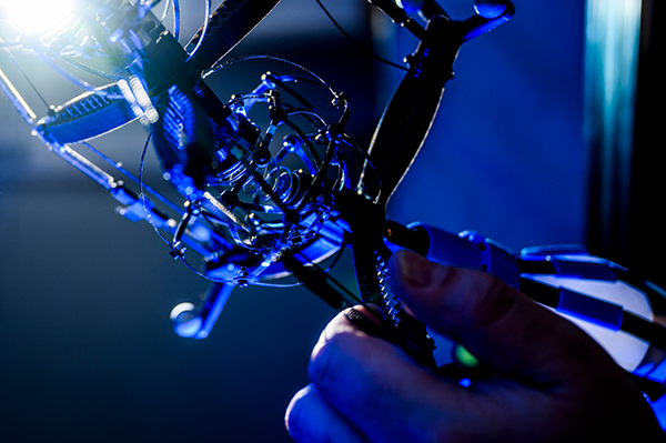 Jeffrey Lipton, assistant professor of mechanical and industrial engineering, holding his robot