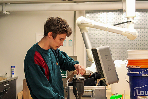 Kelso Fiedler working on his capstone in a dry lab