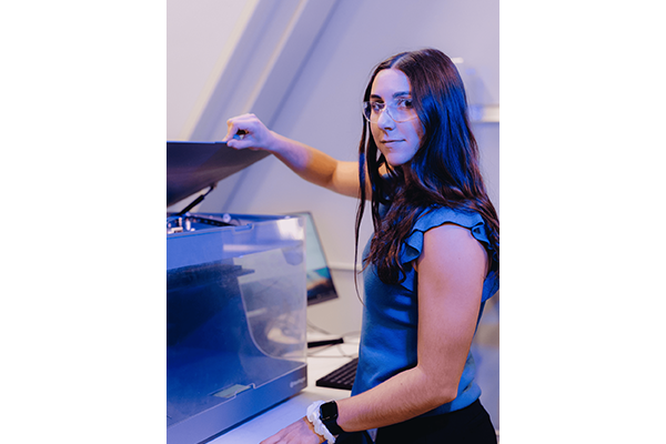 Madison Rodriguez looking directly at the camera while in the lab