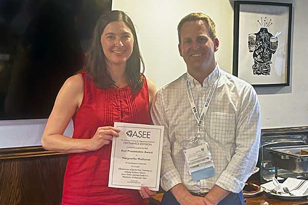 Matherne accepting award