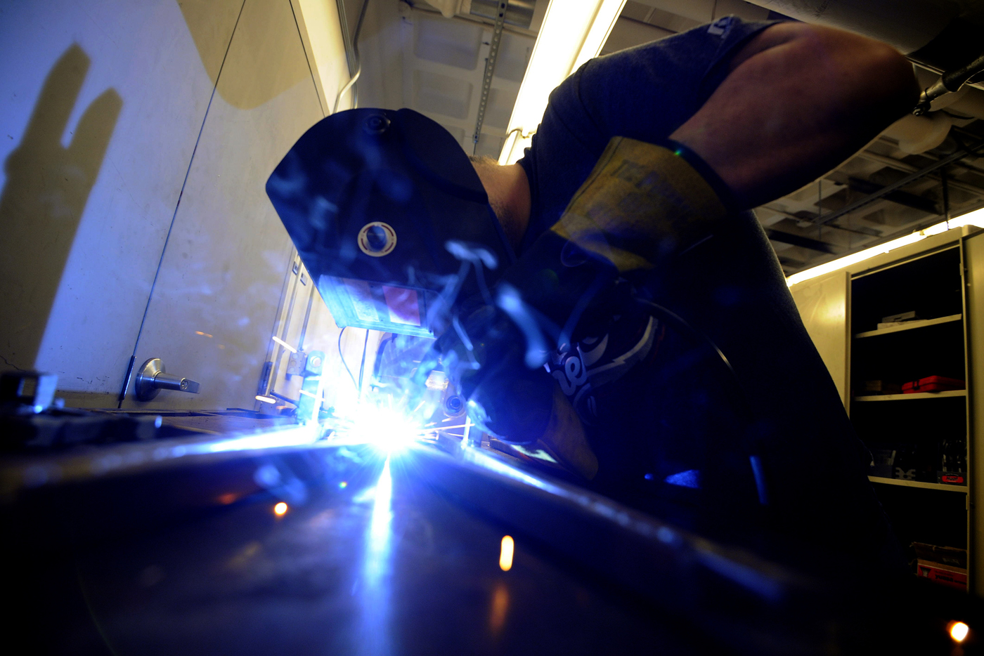 Zach Lozon, E'19, welds a truss member in the basement of Richards Hall.